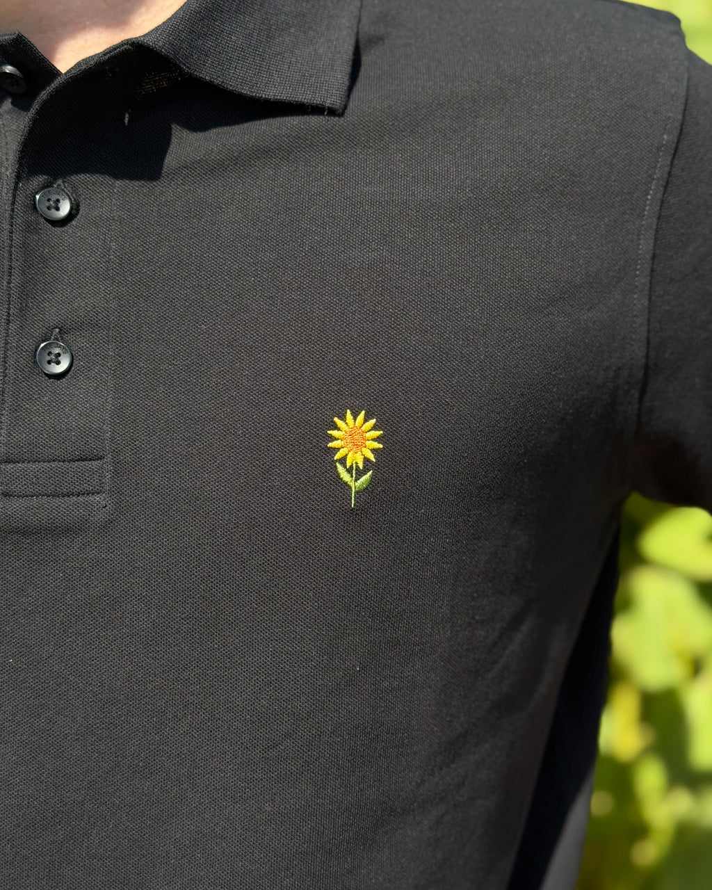 Polo mit Sonnenblume